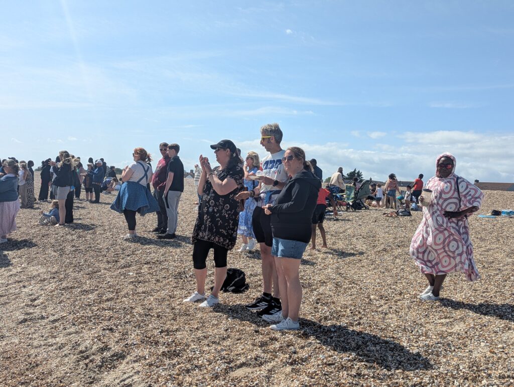 My church community during a baptism service at the beach